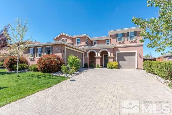385 Teramo Drive Reno, NV 89521 - Photo 1 of 1 a front view of a house with a garden