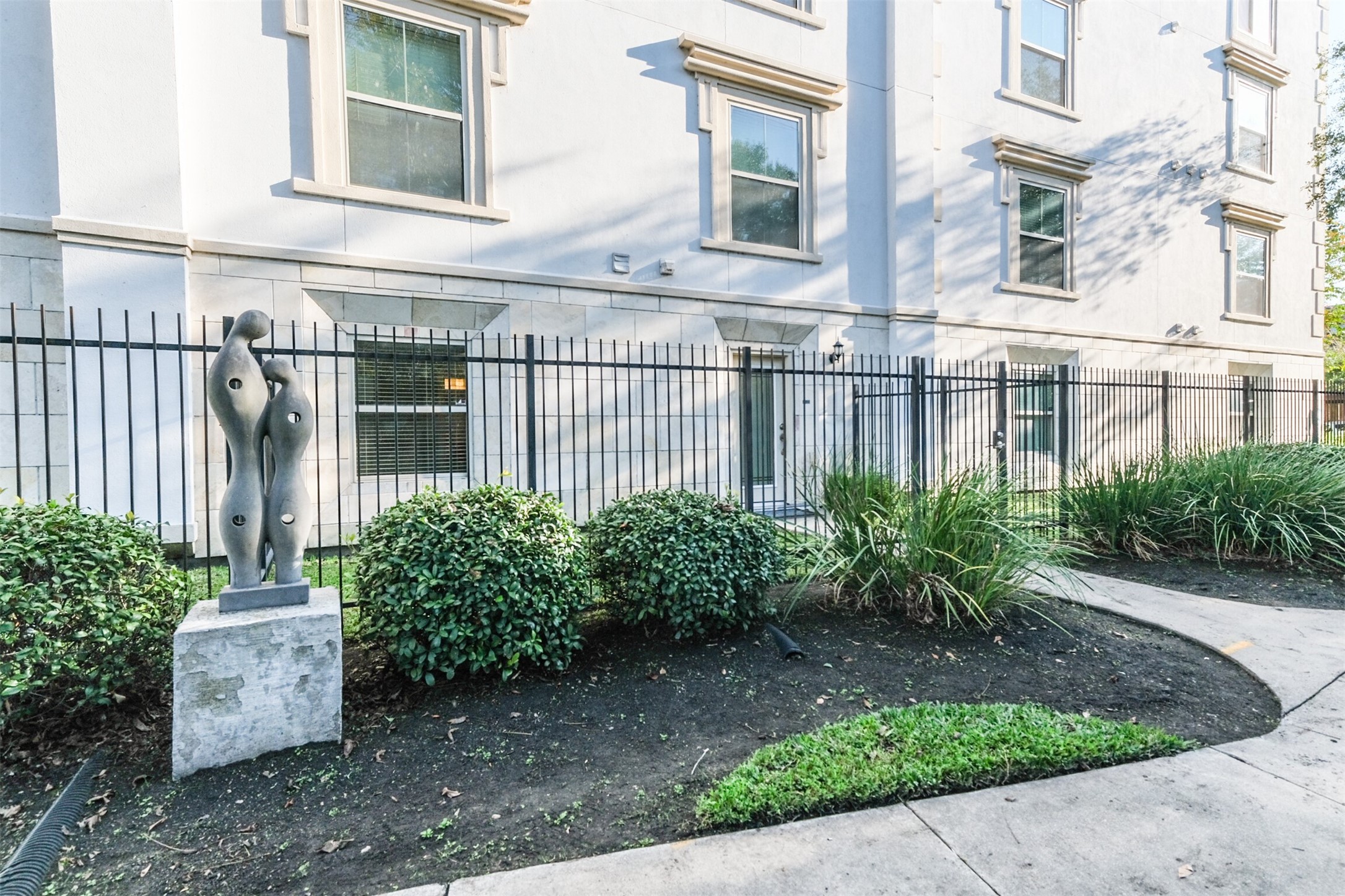 3501 Chenevert Street, Unit 7 Houston, TX 77004 - Photo 1 of 24 a view of a house with a garden and plants