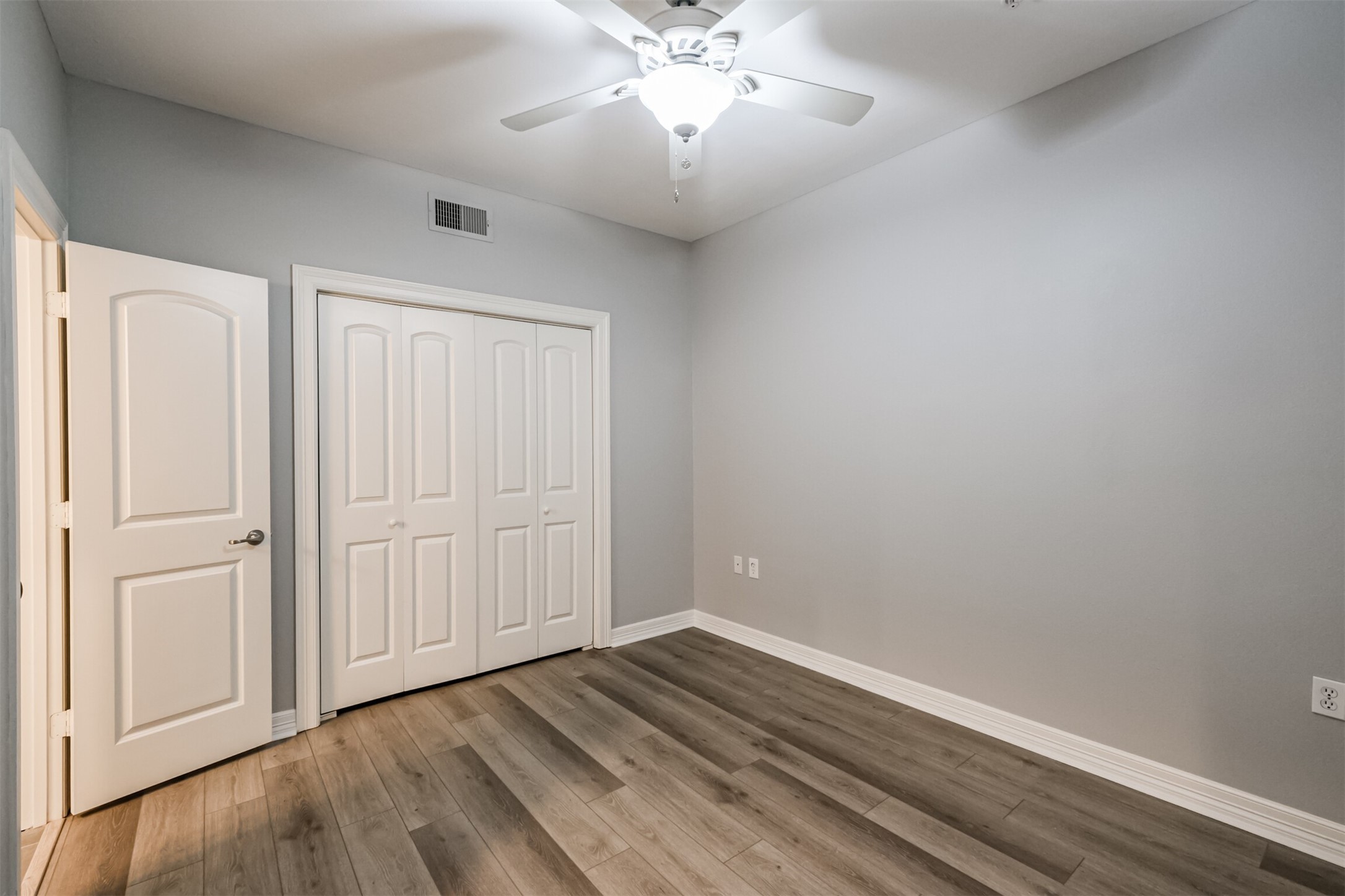 3501 Chenevert Street, Unit 7 Houston, TX 77004 - Photo 11 of 24 wooden floor in an empty room with a window