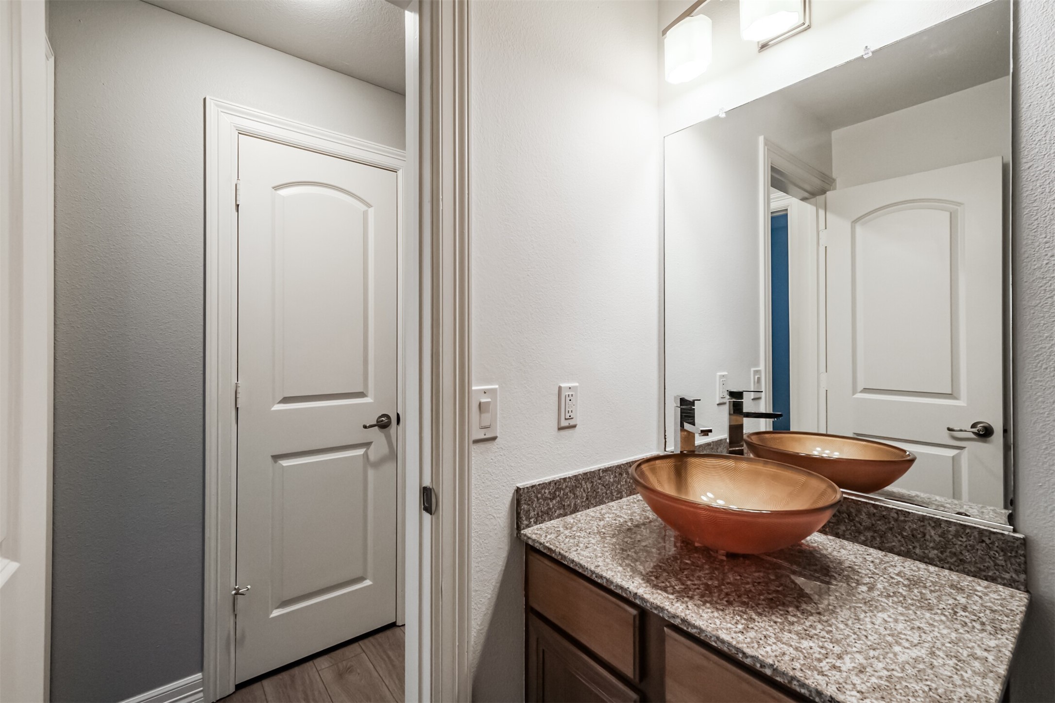 3501 Chenevert Street, Unit 7 Houston, TX 77004 - Photo 14 of 24 a view of a bathroom with a sink and mirror