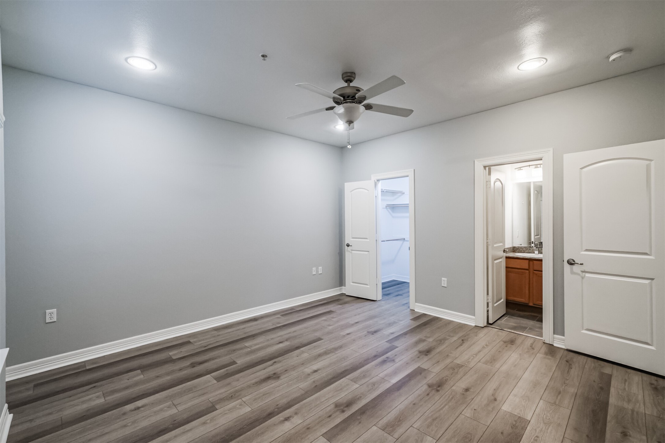 3501 Chenevert Street, Unit 7 Houston, TX 77004 - Photo 18 of 24 wooden floor in an empty room with a window