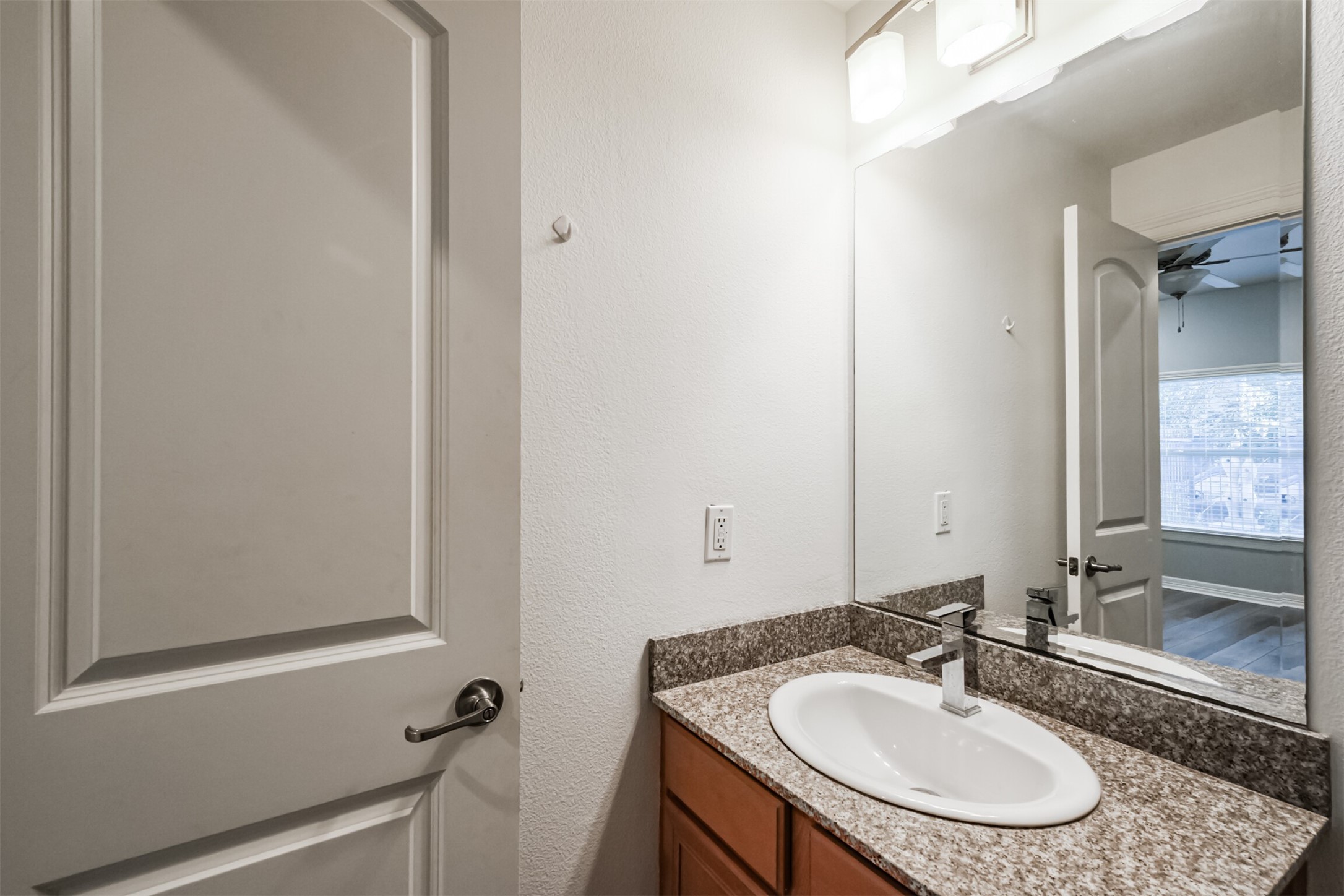 3501 Chenevert Street, Unit 7 Houston, TX 77004 - Photo 20 of 24 a bathroom with a sink and a mirror