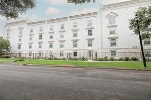 3501 Chenevert Street, Unit 7 Houston, TX 77004 - Photo 3 of 24 a large building with a field in front of it