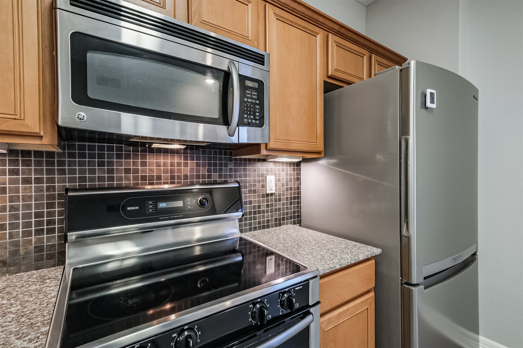3501 Chenevert Street, Unit 7 Houston, TX 77004 - Photo 7 of 24 a kitchen with appliances and cabinets