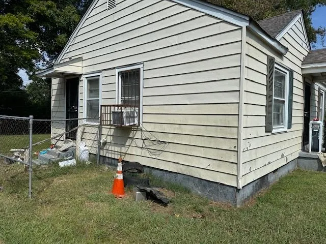 a backyard of a house with outdoor seating