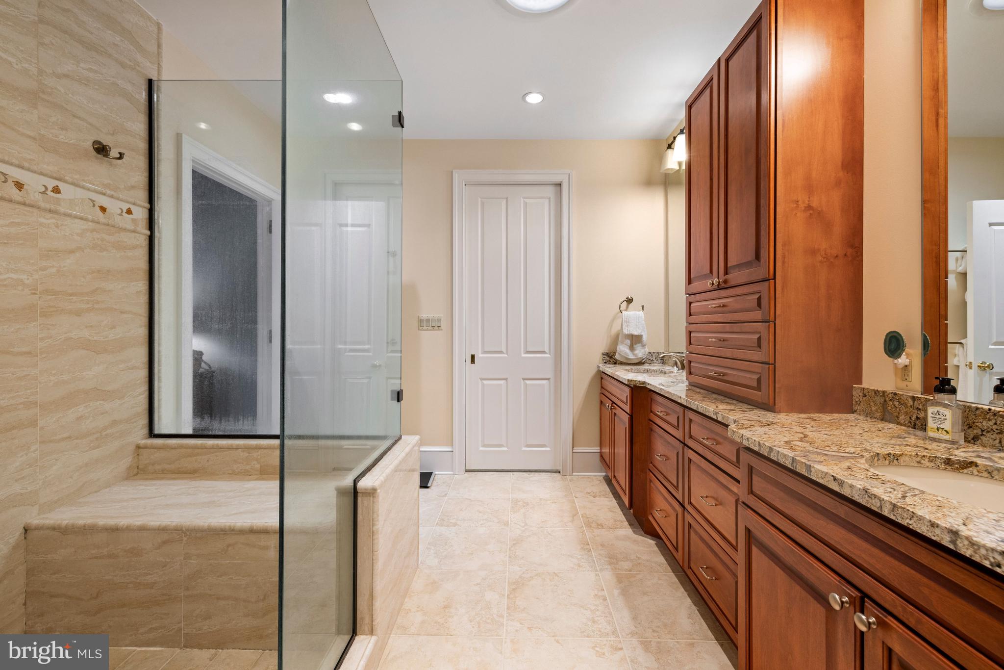 20147 Woodtrail Road Round Hill, VA 20141 - Photo 26 of 41 a bathroom with a double vanity sink and mirror