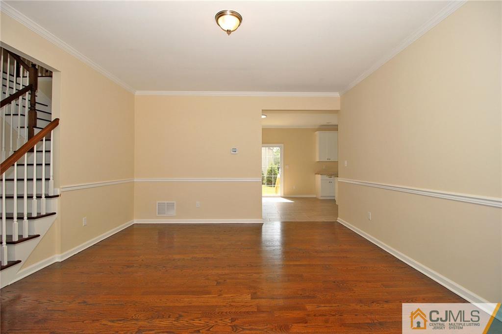 301 Plainfield Road Edison, NJ 08820 - Photo 12 of 25 a view of a room with wooden floor and white walls