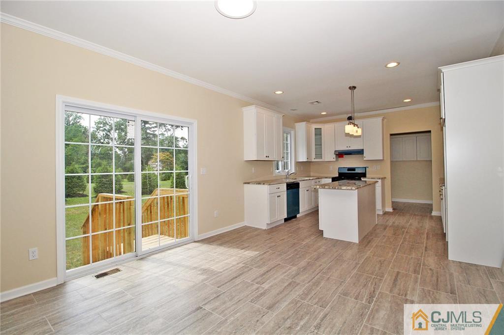 301 Plainfield Road Edison, NJ 08820 - Photo 16 of 25 a view of kitchen with furniture and wooden floor