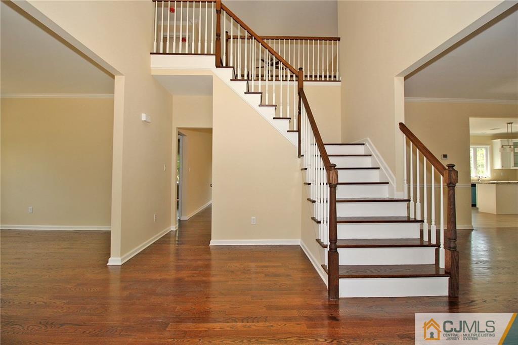 301 Plainfield Road Edison, NJ 08820 - Photo 8 of 25 a view of entryway with wooden floor and stairs