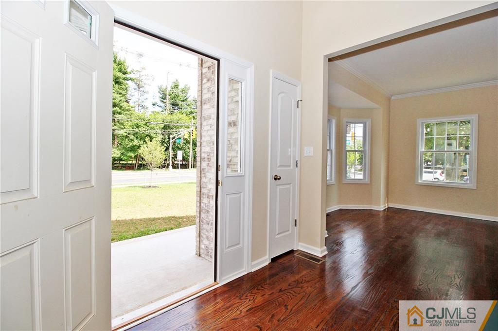 301 Plainfield Road Edison, NJ 08820 - Photo 9 of 25 a view of an entryway with wooden floor and a window