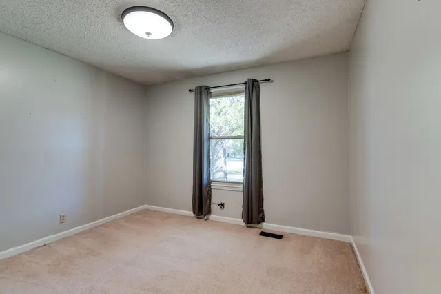 an empty room with window