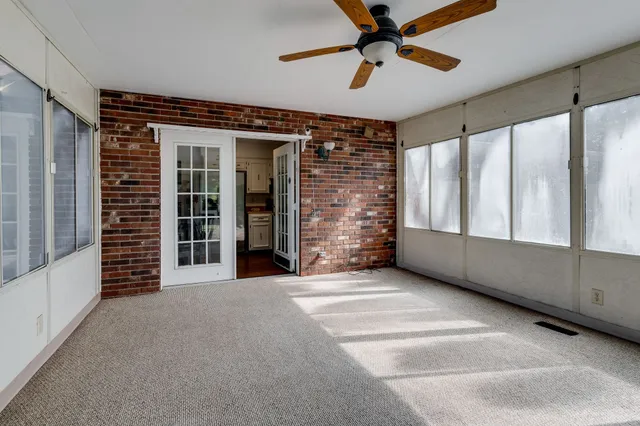 a view of an empty room with stairs