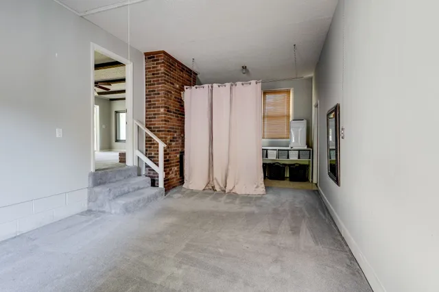 a kitchen with a stove and a refrigerator
