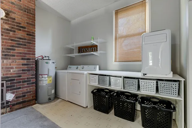 a view of a house with pool and sitting area