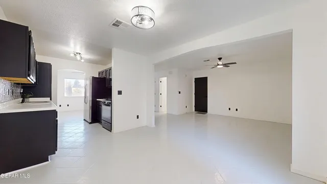 a kitchen with stainless steel appliances granite countertop a sink and cabinets