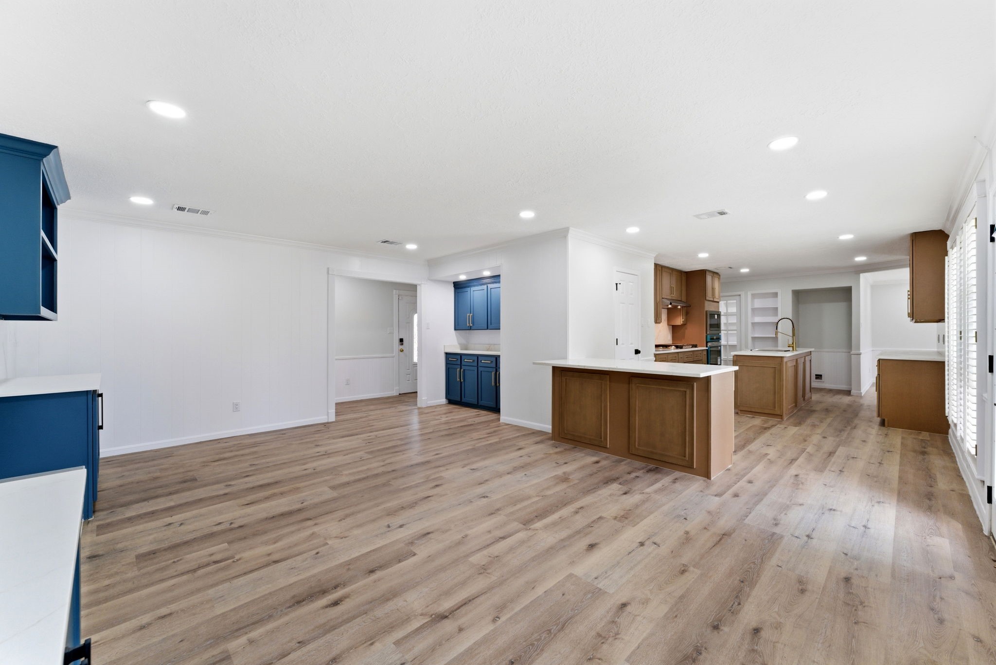 5203 Woodville Lane Spring, TX 77379 - Photo 14 of 50 The open-concept layout flows effortlessly from the living area to the kitchen, ideal for hosting gatherings of any size.