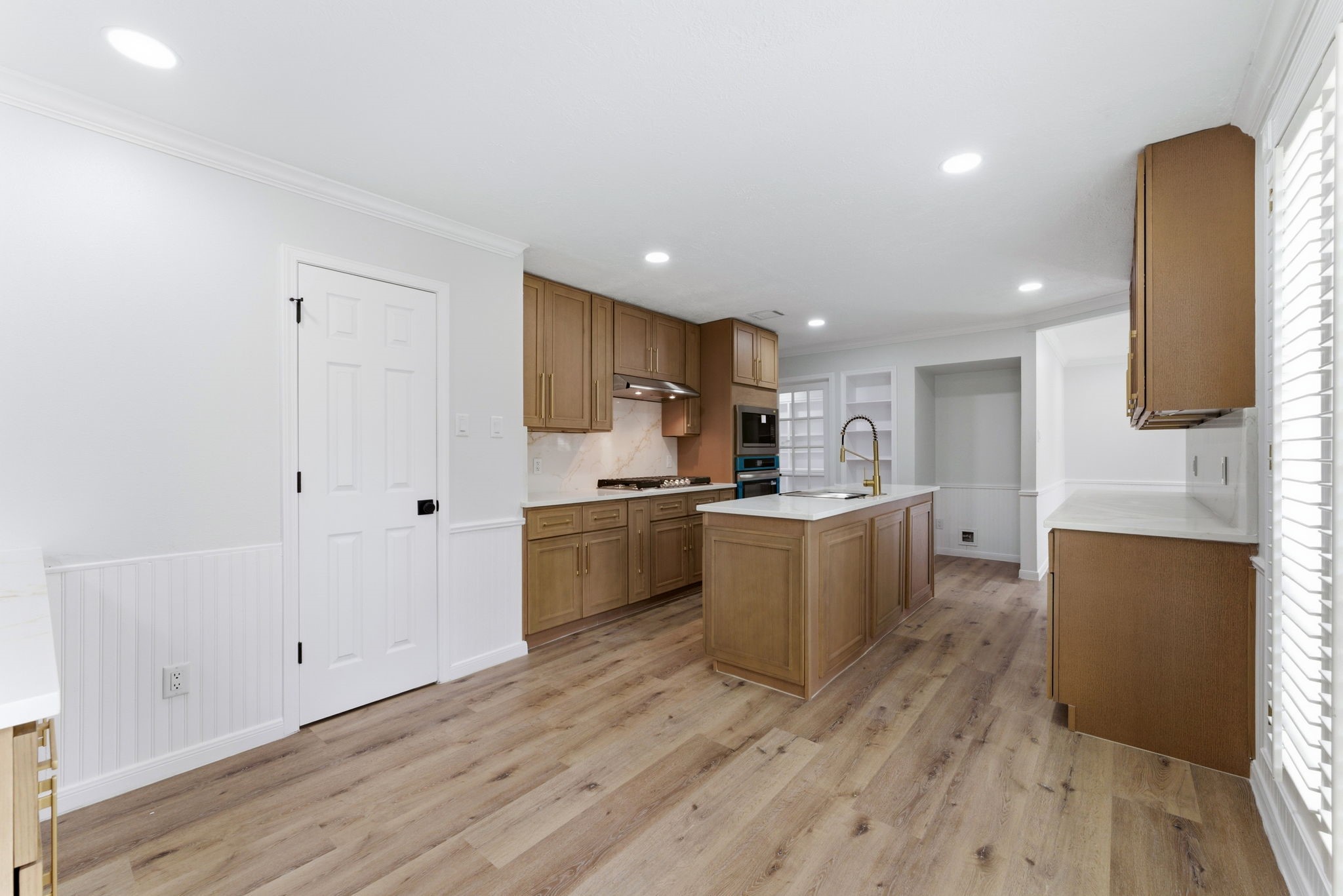 5203 Woodville Lane Spring, TX 77379 - Photo 16 of 50 Experience an expansive view of your culinary kingdom, featuring a large center island and high-end finishes that make meal prep a joy.