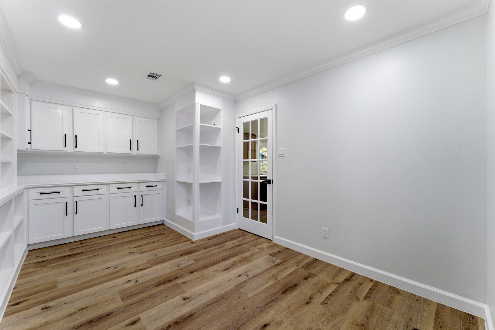 5203 Woodville Lane Spring, TX 77379 - Photo 24 of 50 The elegant French door adds a touch of sophistication to your workday, offering a quiet retreat that still feels light and connected.