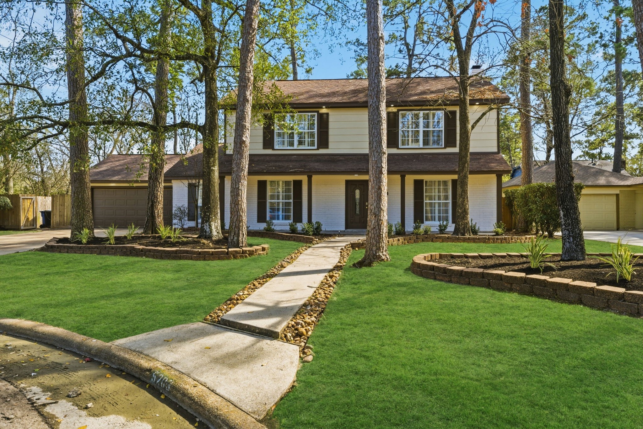 5203 Woodville Lane Spring, TX 77379 - Photo 4 of 50 Grand Entrance. A winding path that leads you through a lush, tree-shaded lawn to your private front door.