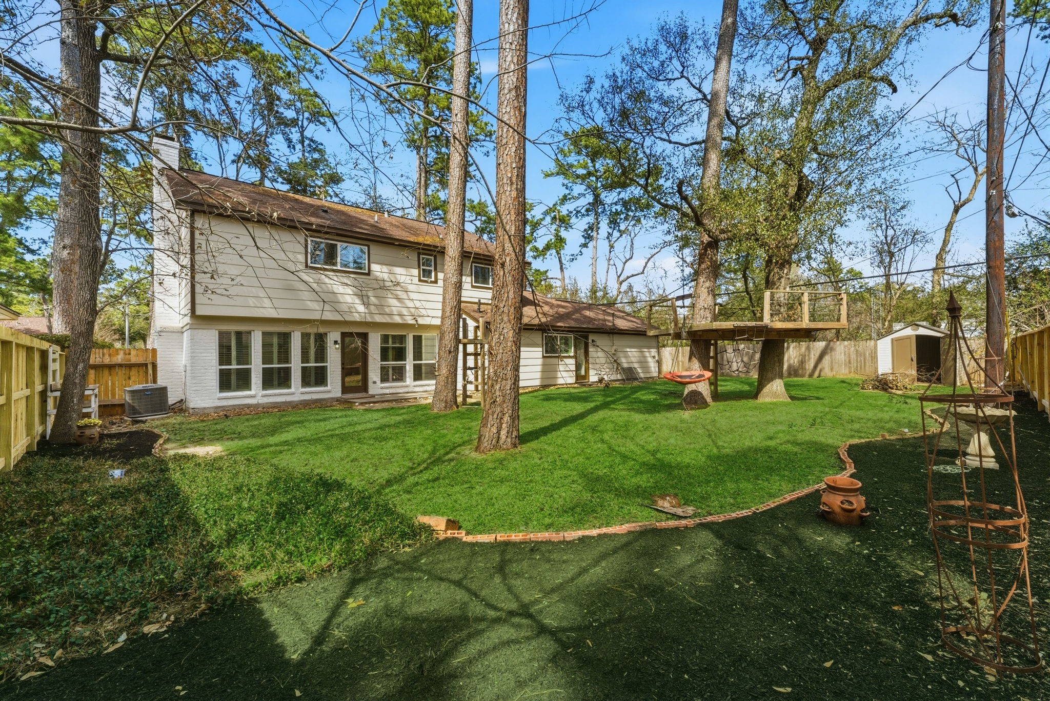 5203 Woodville Lane Spring, TX 77379 - Photo 48 of 50 With a built-in treehouse and plenty of shade, this backyard is a dream come true for explorers of all ages.