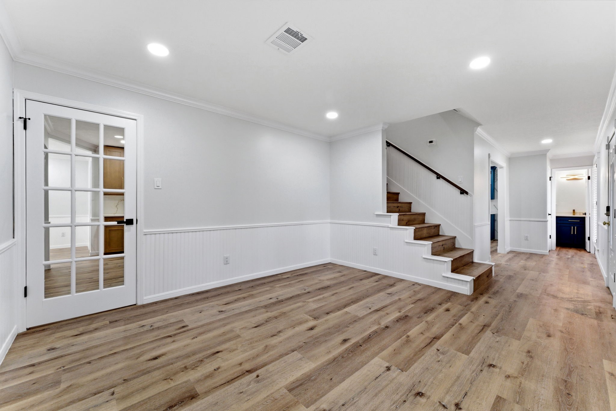 5203 Woodville Lane Spring, TX 77379 - Photo 9 of 50 This bright, spacious room is a blank canvas—perfect for a formal dining area, a quiet home office, or a cozy reading lounge.