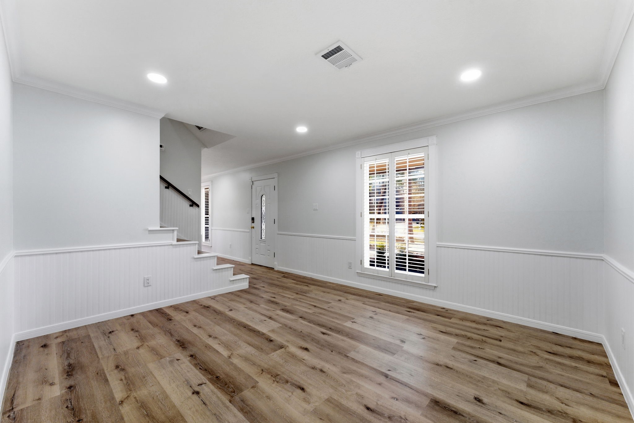 5203 Woodville Lane Spring, TX 77379 - Photo 10 of 50 Recessed lighting and crisp white walls enhance the open atmosphere, making every corner of this home feel inviting.