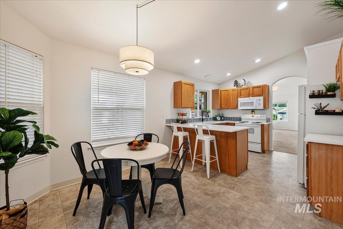 2356 West Hill Road Boise, ID 83702 - Photo 8 of 22 Kitchen with wood cabinetry, white countertops, and white appliances