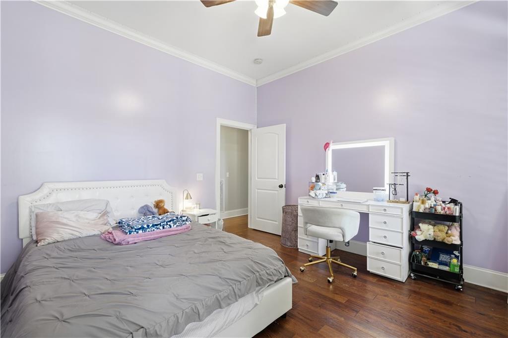 310 Gaines Road Southeast Dalton, GA 30721 - Photo 28 of 53 a bedroom with a bed and a chandelier