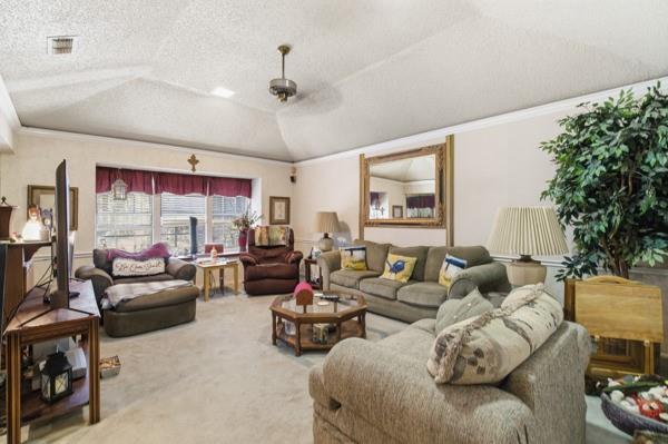 4109 Hackmore Loop Irving, TX 75061 - Photo 8 of 13 a living room with furniture and a large window
