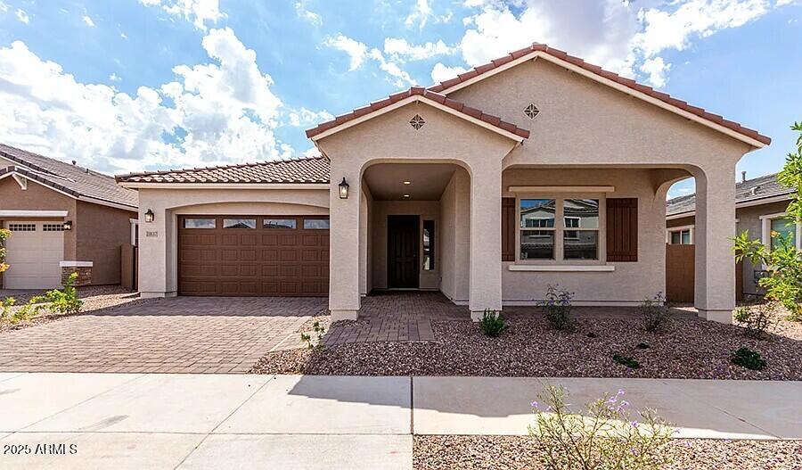 21837 East Bonanza Court Queen Creek, AZ 85142 - Photo 1 of 15 a front view of a house with garden