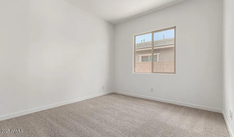 21837 East Bonanza Court Queen Creek, AZ 85142 - Photo 12 of 15 an empty room with a window