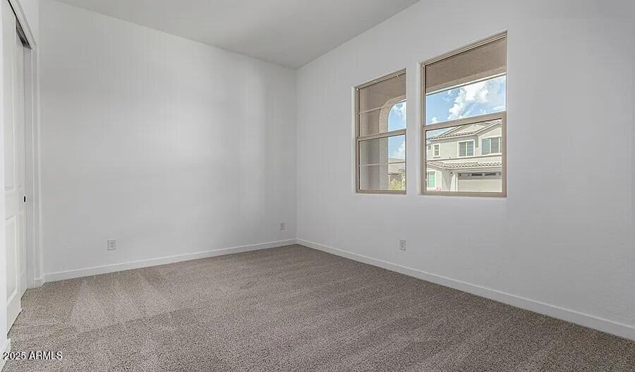 21837 East Bonanza Court Queen Creek, AZ 85142 - Photo 8 of 15 an empty room with a window
