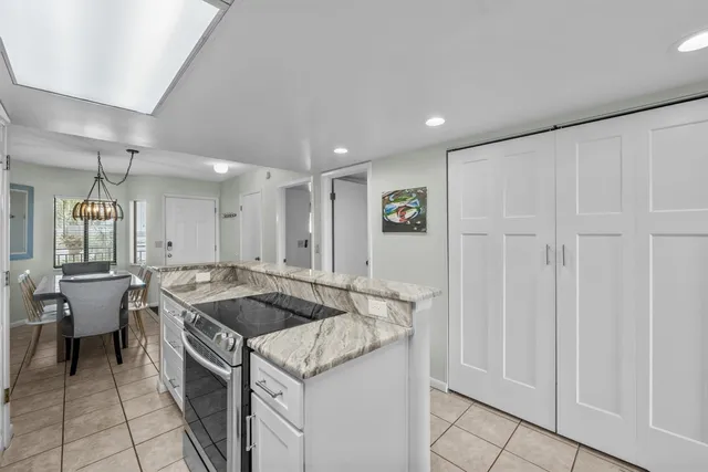 a spacious bathroom with a granite countertop sink mirror and double