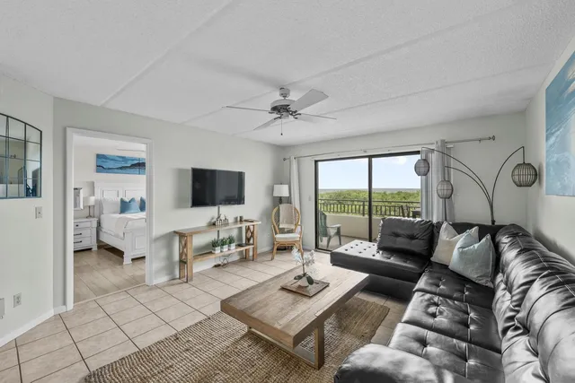 a bathroom with a granite countertop toilet sink and mirror