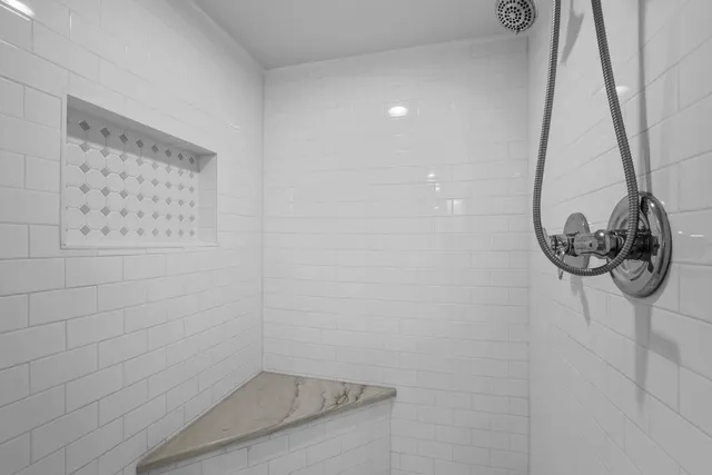 a spacious bedroom with two beds and a table