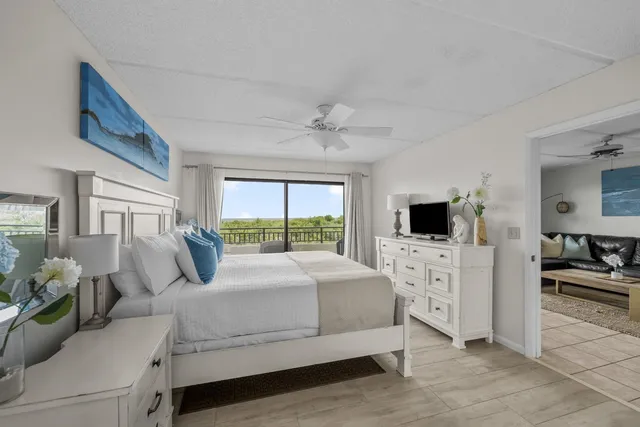 a bathroom with a granite countertop double vanity sink and a mirror