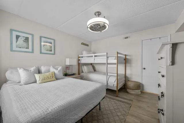 a view of a balcony with chair and wooden floor
