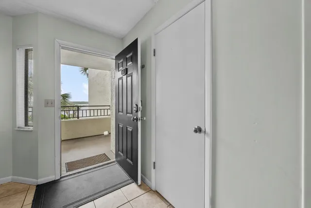 a kitchen with stainless steel appliances kitchen island granite countertop a sink and a refrigerator