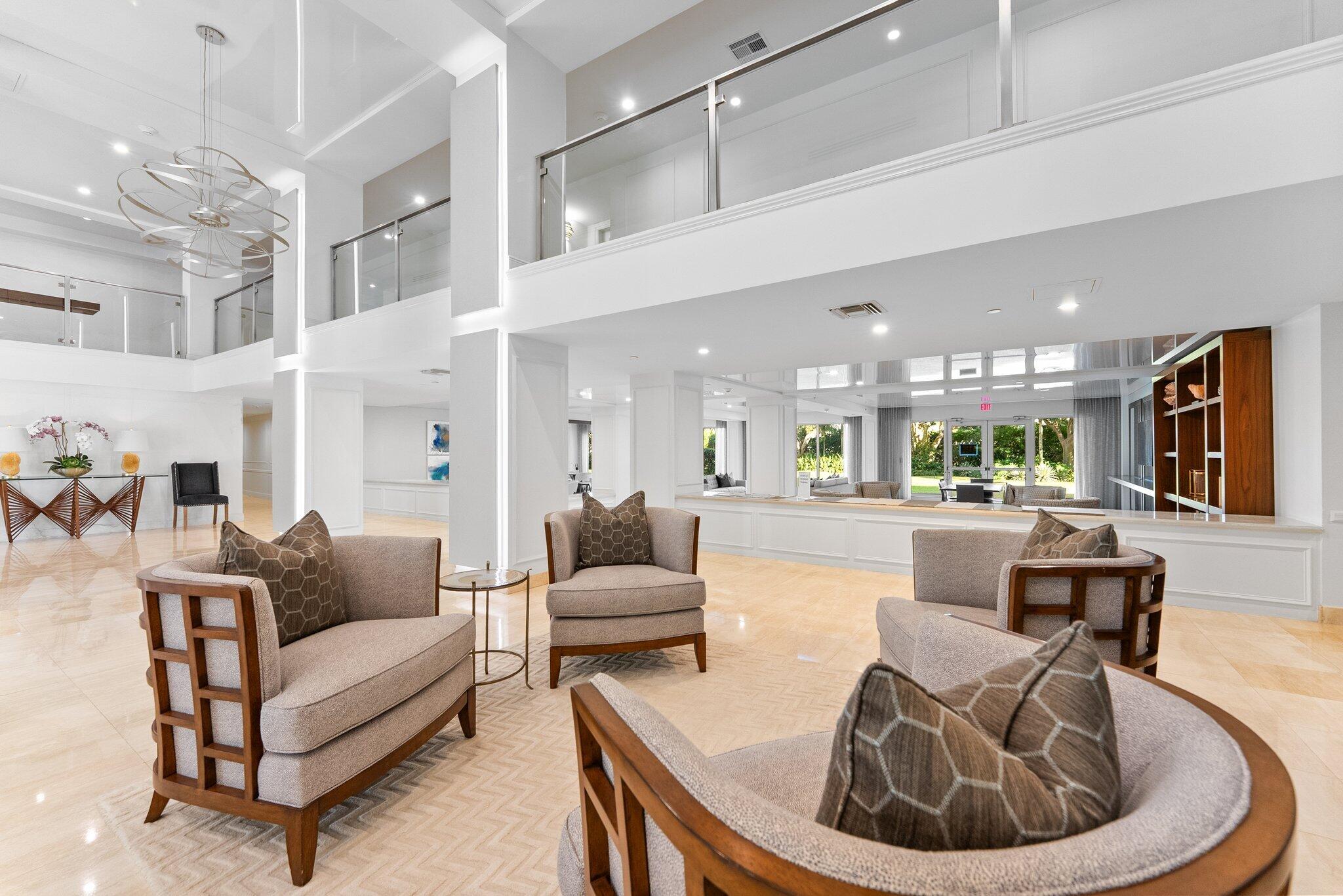 875 East Camino Real, Unit 2G Boca Raton, FL 33432 - Photo 46 of 55 a living room with furniture and a large window