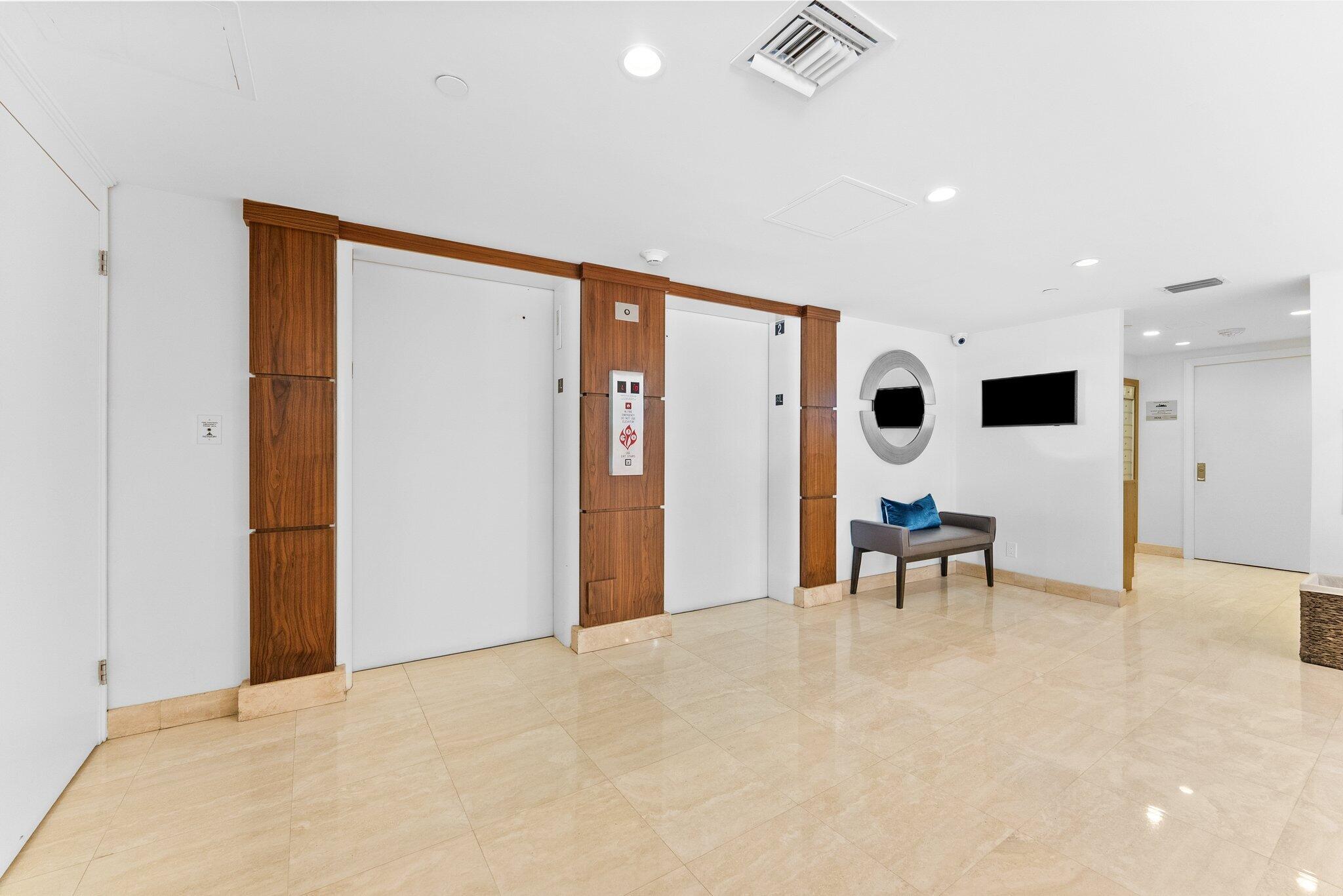 875 East Camino Real, Unit 2G Boca Raton, FL 33432 - Photo 49 of 55 a very nice looking room with a large window