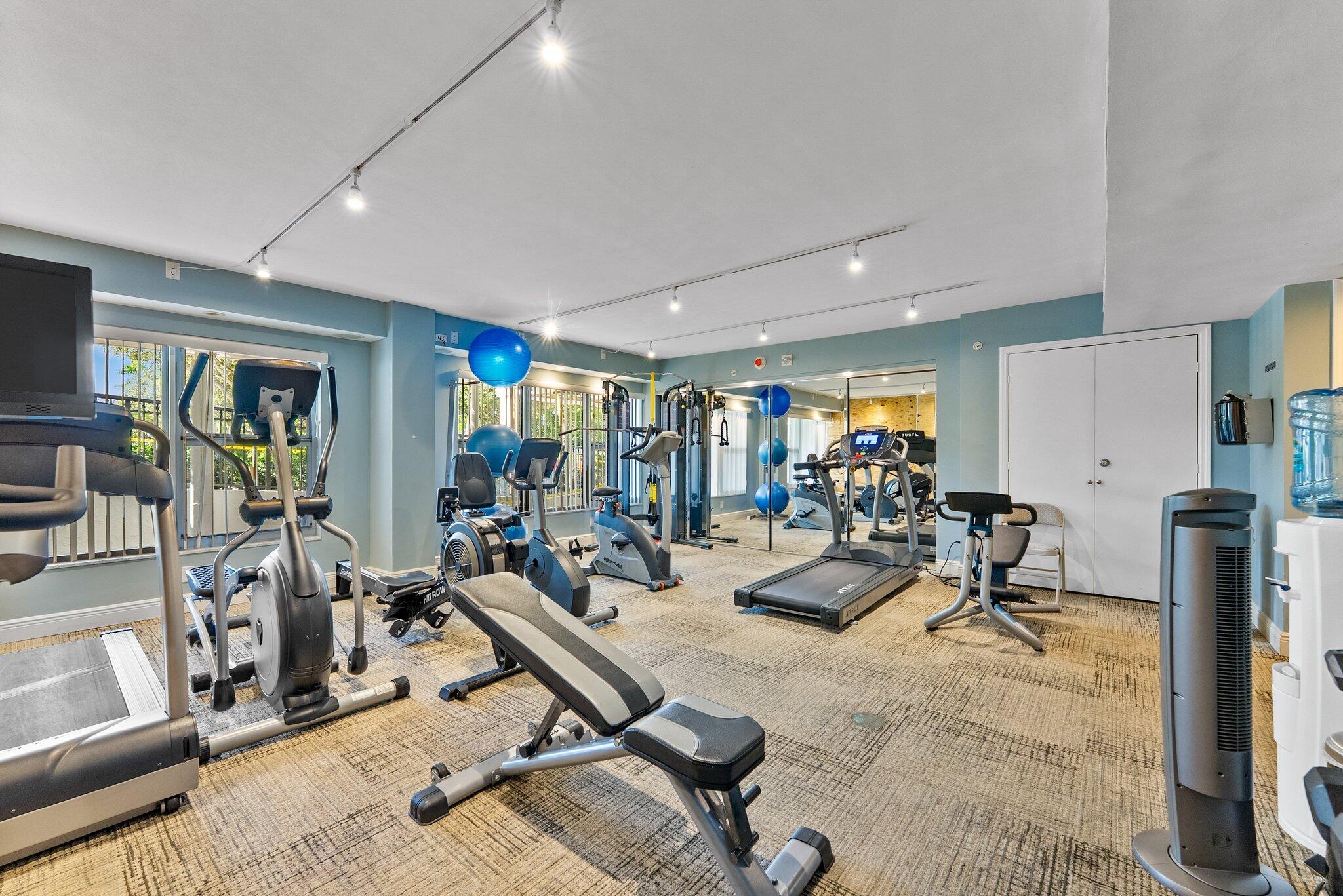 875 East Camino Real, Unit 2G Boca Raton, FL 33432 - Photo 54 of 55 a room with gym equipment and a large window