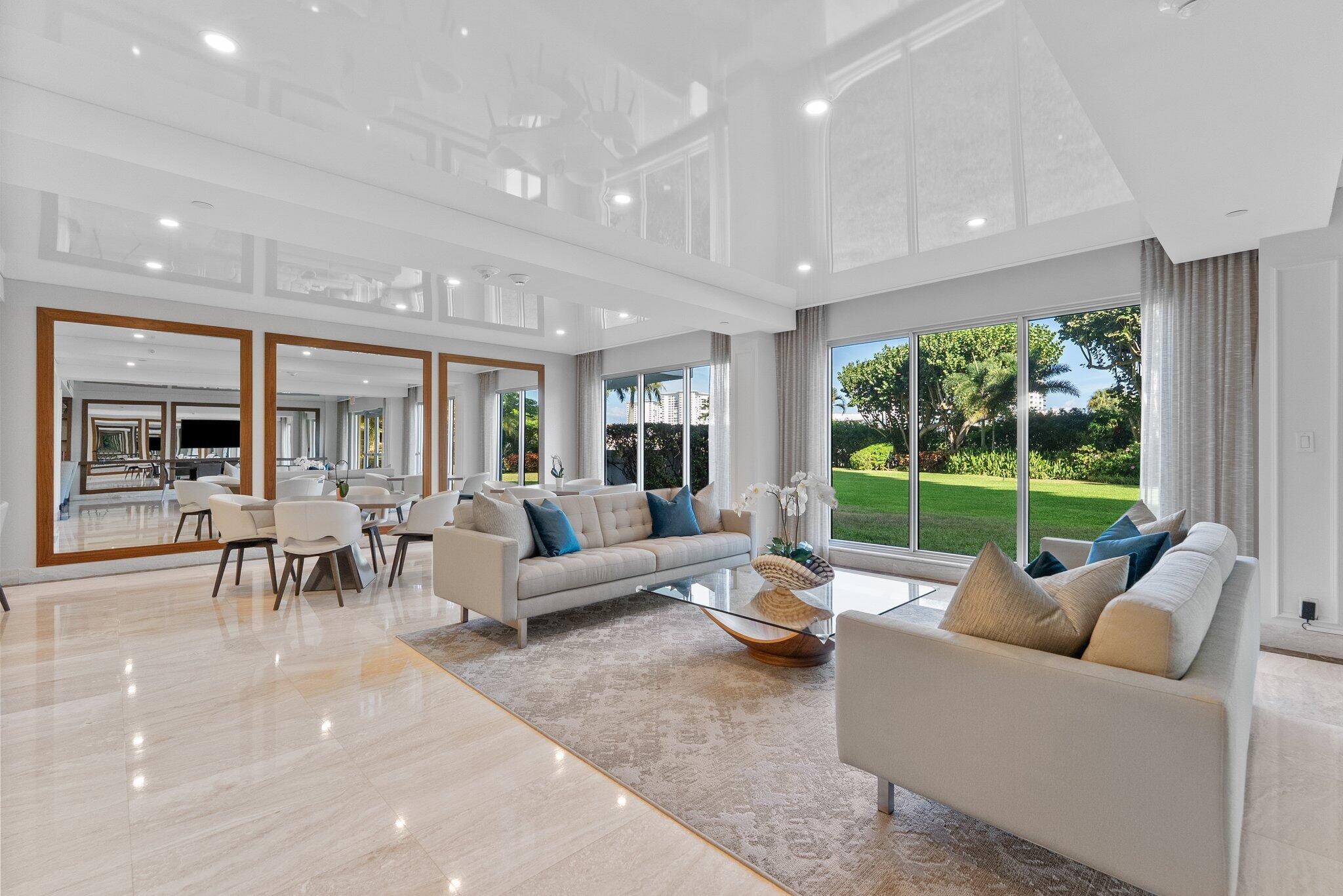 875 East Camino Real, Unit 2G Boca Raton, FL 33432 - Photo 55 of 55 a living room with furniture and a large window
