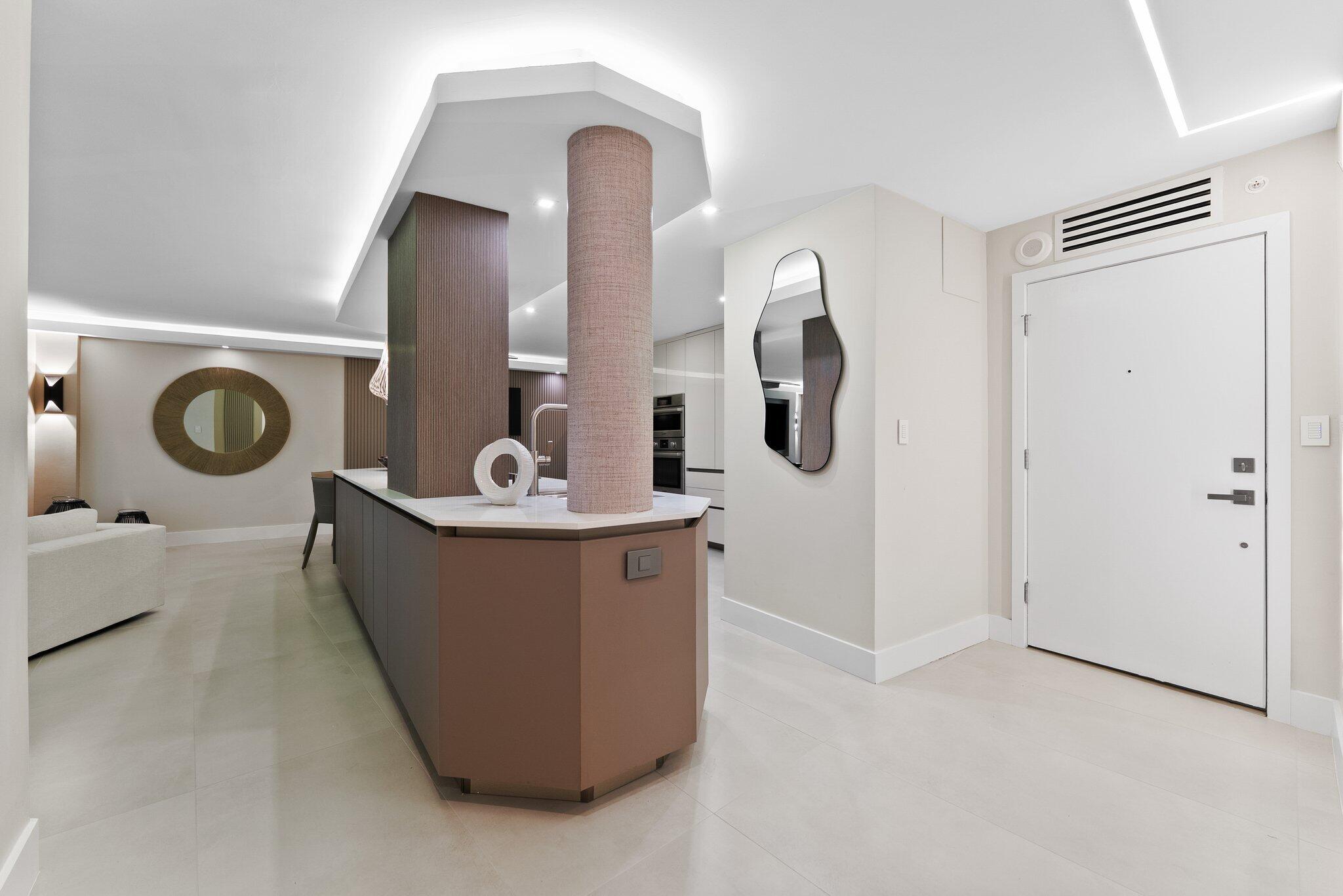 875 East Camino Real, Unit 2G Boca Raton, FL 33432 - Photo 6 of 55 a view of living room with washer and dryer