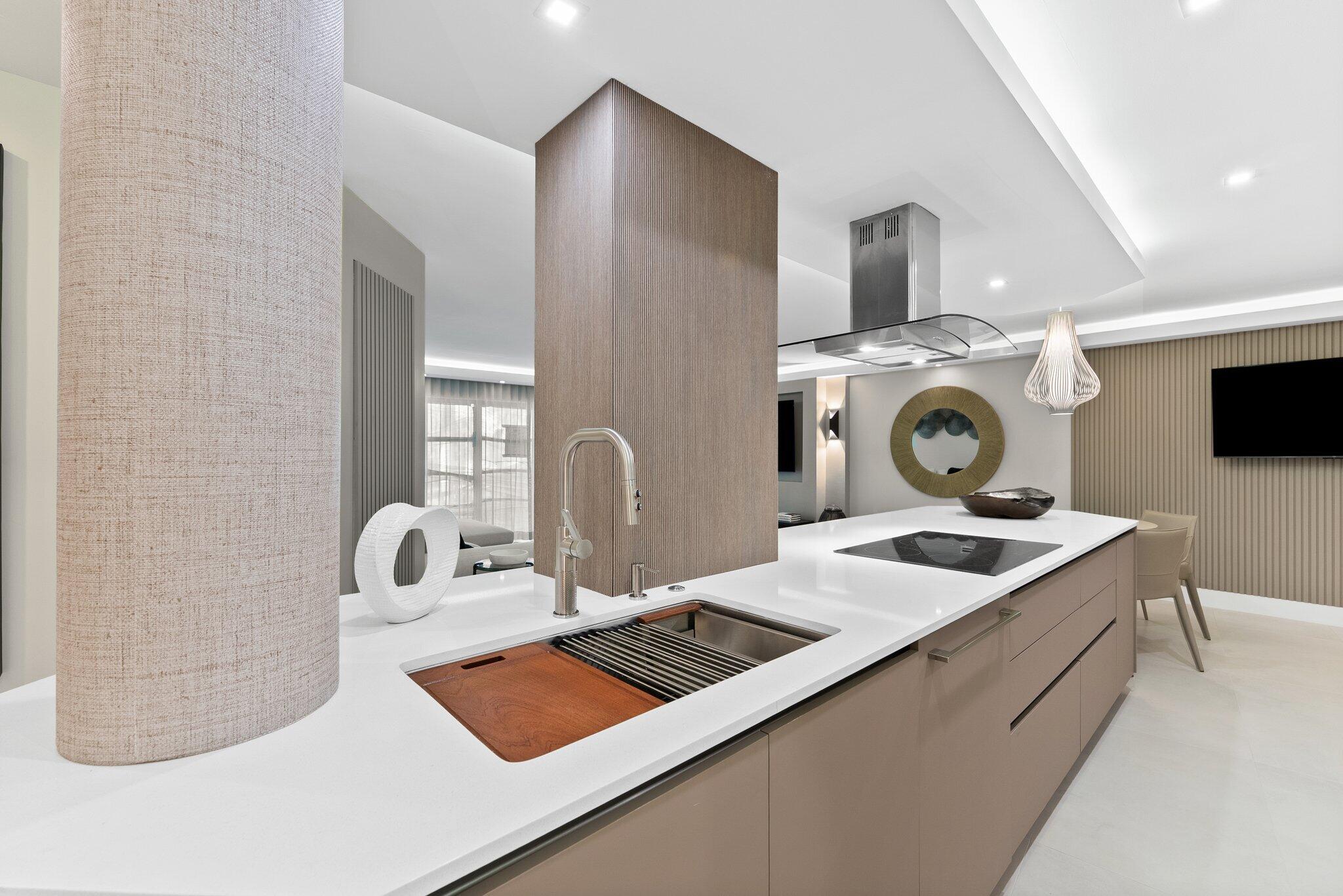 875 East Camino Real, Unit 2G Boca Raton, FL 33432 - Photo 8 of 55 a kitchen with a stove and a white cabinets