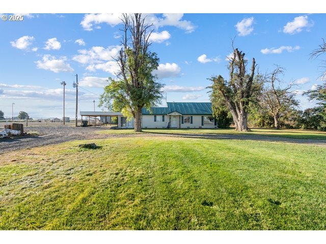 a swimming pool with outdoor seating and yard