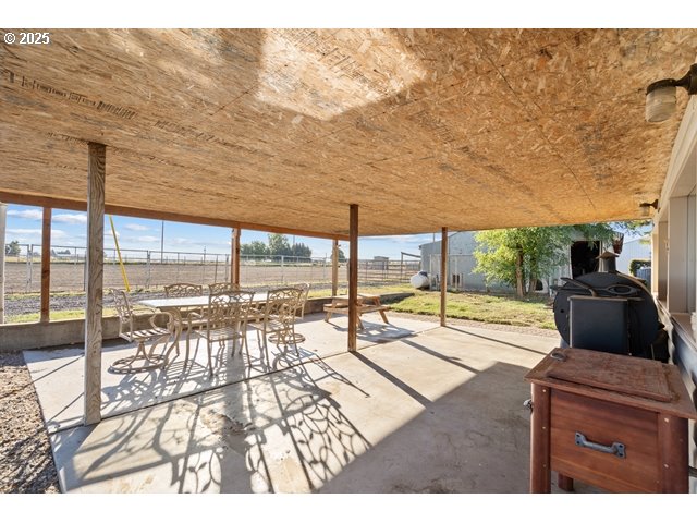 33968 East Loop Road Stanfield, OR 97875 - Photo 20 of 48 a living room with a floor to ceiling window and wooden floor