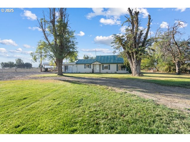 33968 East Loop Road Stanfield, OR 97875 - Photo 2 of 48 a view of swimming pool with outdoor seating and trees in the background