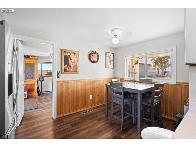 33968 East Loop Road Stanfield, OR 97875 - Photo 8 of 48 a view of a dining room with furniture and wooden floor