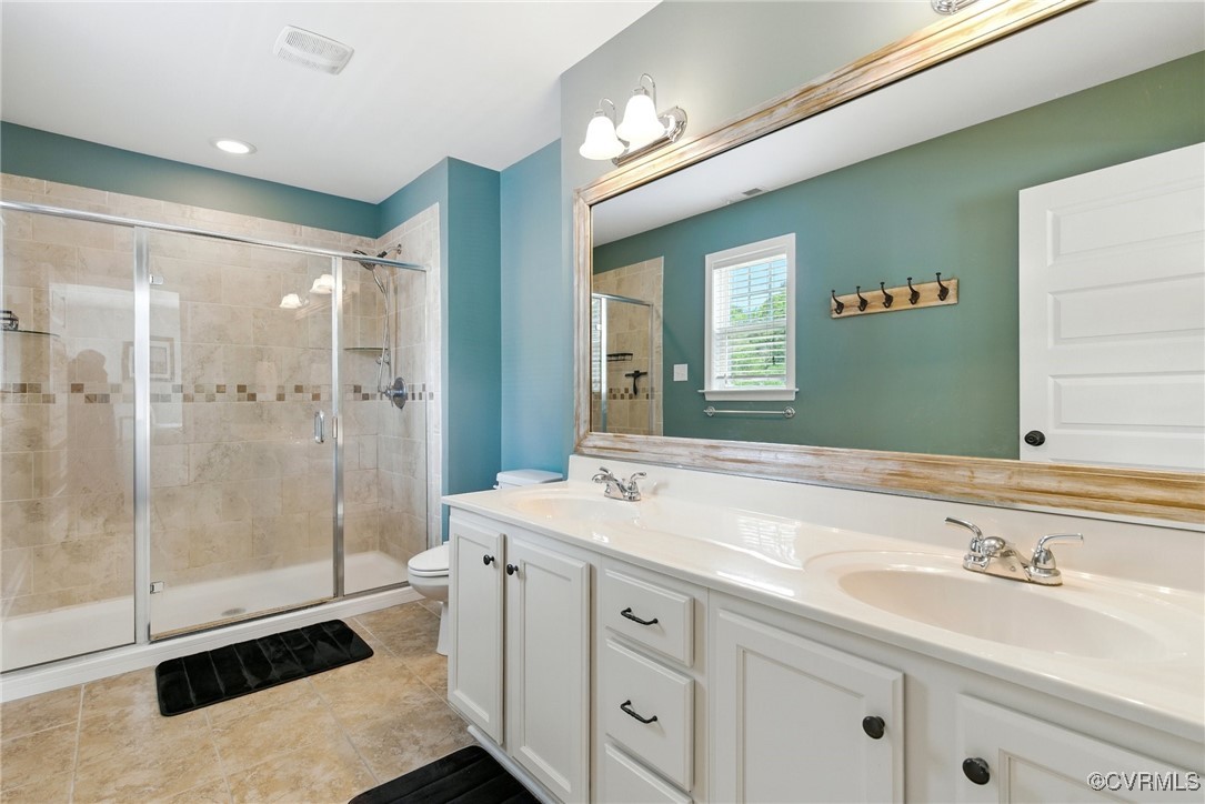 2201 Vandover Road Henrico, VA 23229 - Photo 14 of 43 a spacious bathroom with a shower sink and mirror