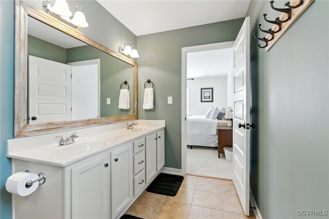 2201 Vandover Road Henrico, VA 23229 - Photo 15 of 43 a en suite bathroom with a double vanity sink and mirror